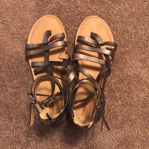 Maurices gladiator sandals in gunmetal brass color. Size 8.5